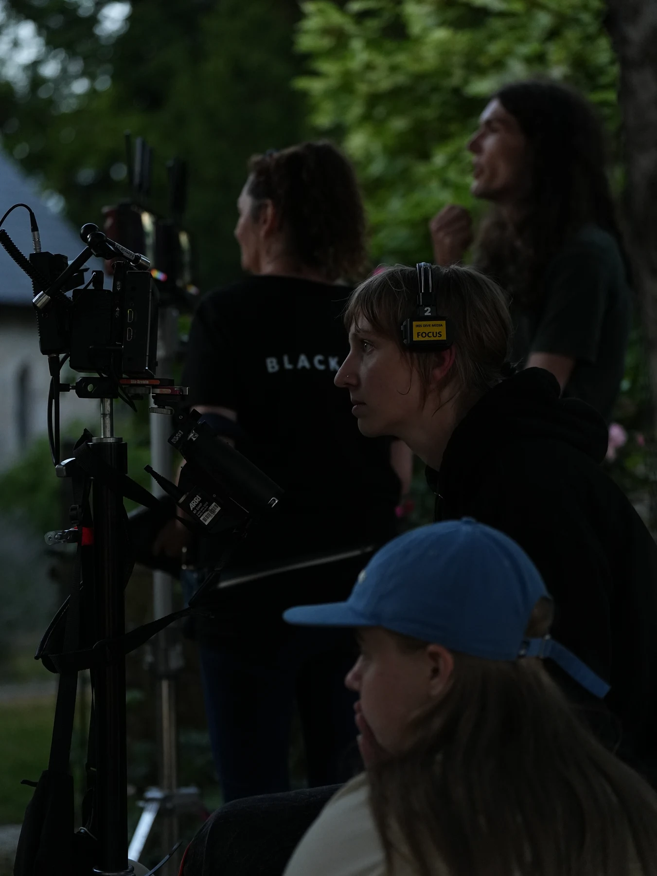 Crew working beside a camera rig outdoors